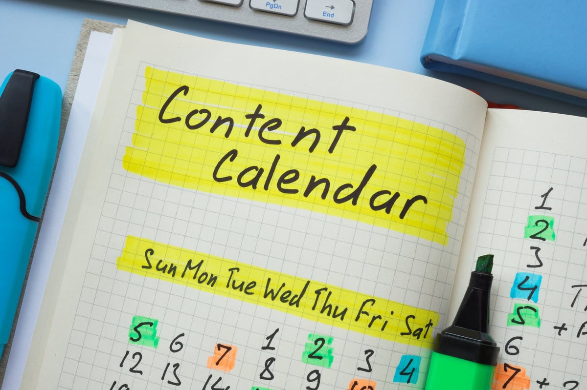 Notebook with content calendar written.